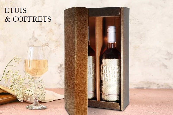 Bottle and glass of champagne on table